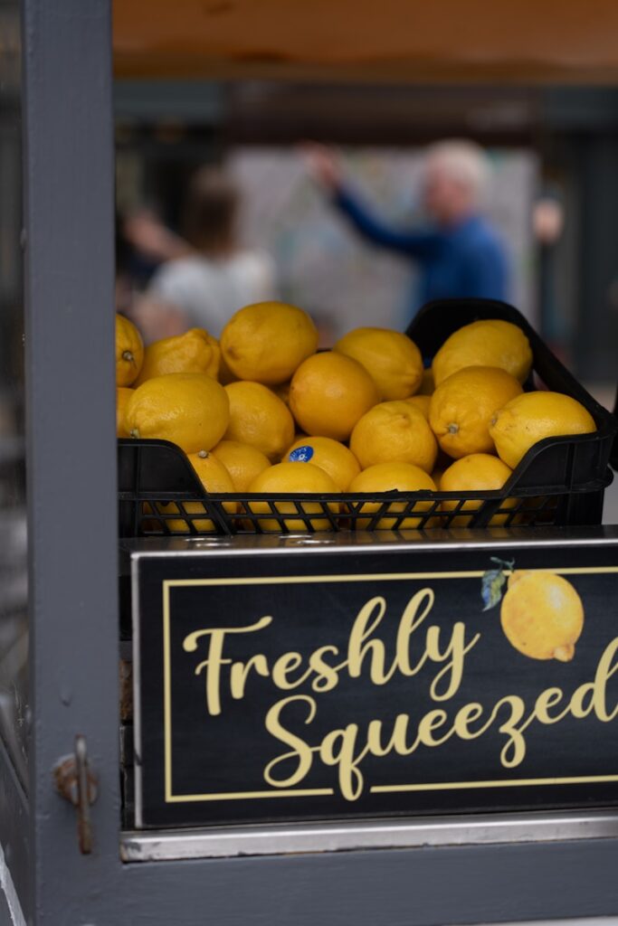 A display of fresh lemons for sale in a store